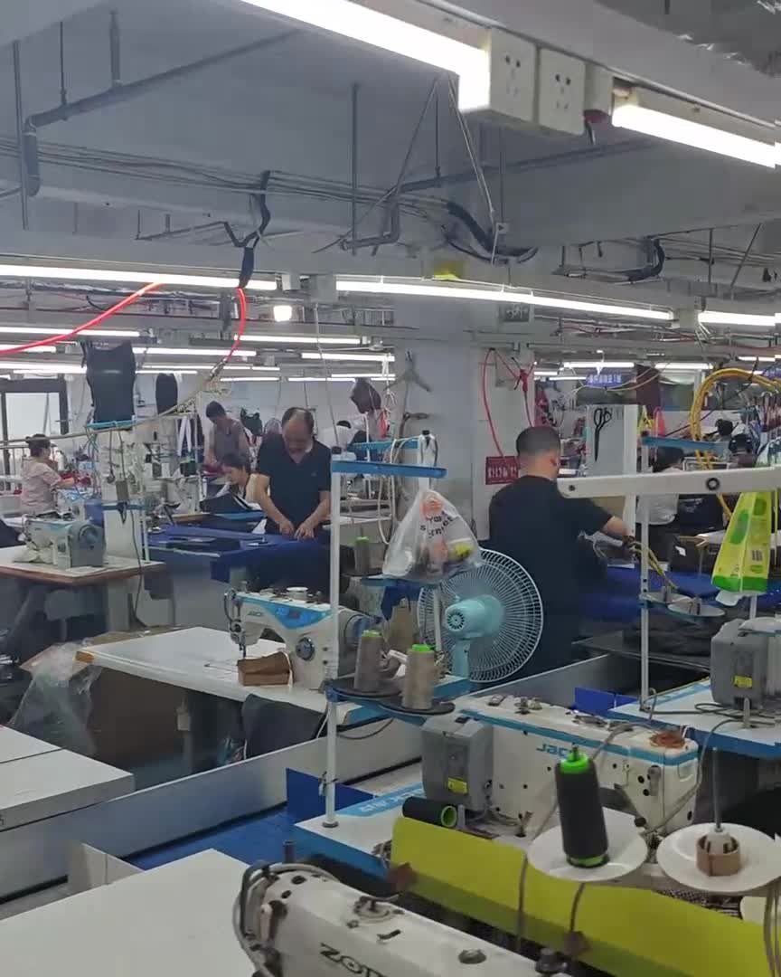 Sewing machines and workers on the factory floor